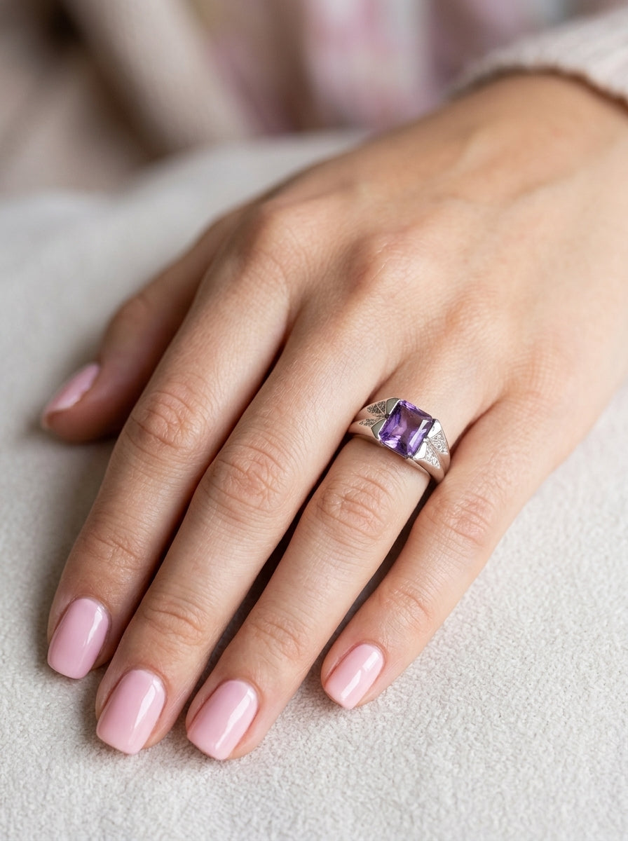 hand  beautiful dress ring crafted in 14ct white gold (stamped 585), featuring a stunning rectangular-cut Tanzanite measuring approximately 9 x 7.5mm, estimated at 2.5 carats. 