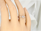 hand  beautifully crafted solitaire ring featuring a brilliant-cut white diamond 