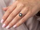 hand  cluster ring, features to the centre a cultured pearl 3.6mm.

Surrounded by eight round sapphires 