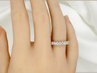 hand gorgeous half-hoop eternity ring set with nine oval brilliant-cut white diamonds.
