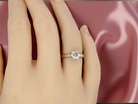 hand  iconic solitaire ring. Features an impressive brilliant cut white diamond. 