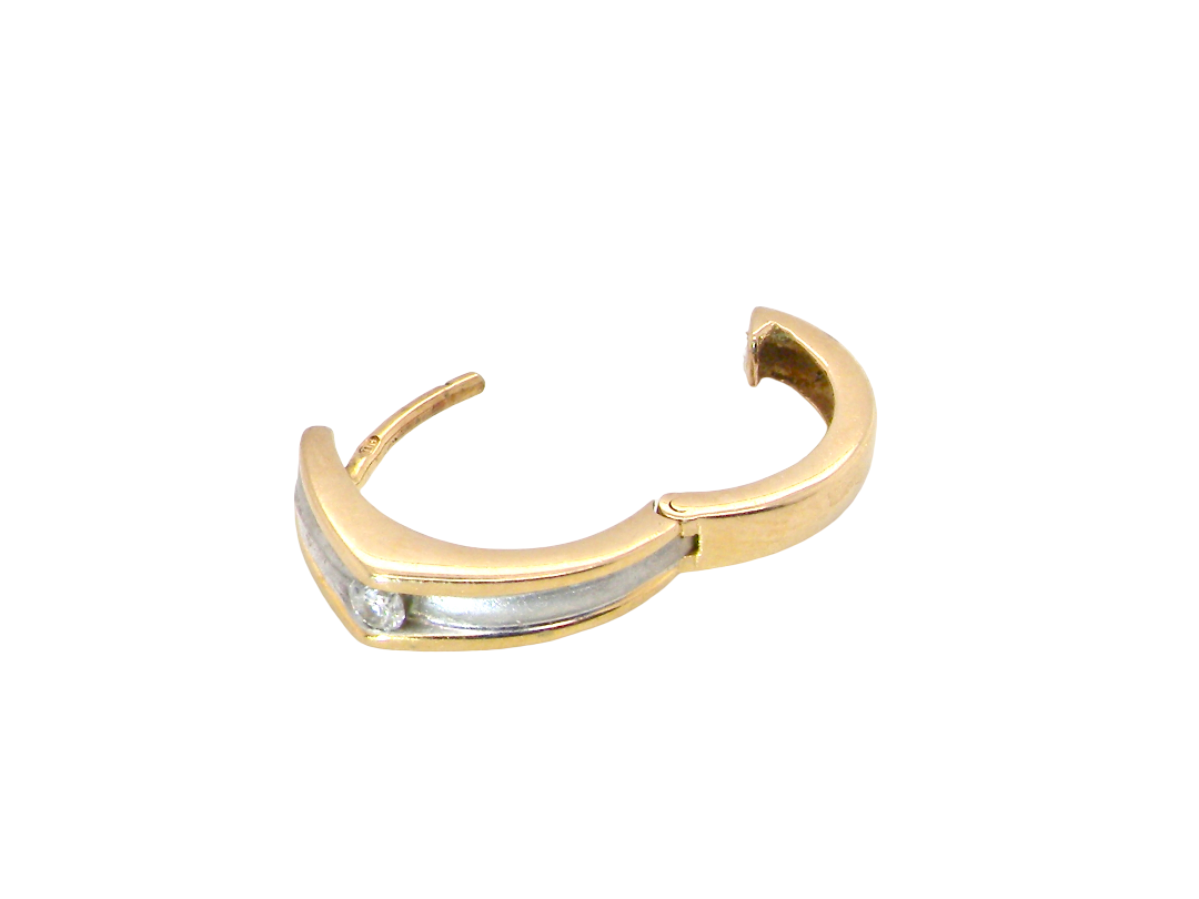 A gold huggie hoop earring with a silver-toned inlay along the front curve, shown on a plain white background.