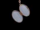 inside A 9 carat gold locket*, oval shaped, measures 30x20mm, depth 5mm.&nbsp;