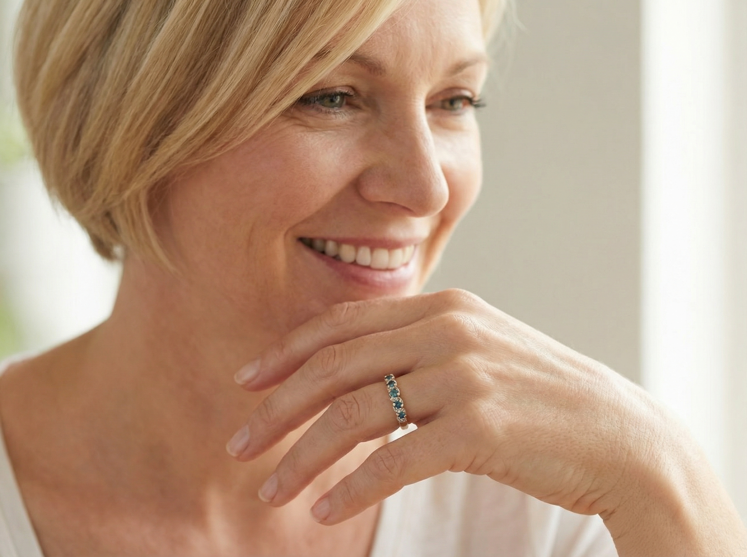 model A 9 carat gold half hoop eternity ring. Set with five blue topaz gem stones, each 2.8mm.&nbsp;
