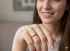 model A beautiful 18-carat gold half-hoop eternity ring set with alternating rubies and diamonds. 