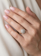 model A beautiful vintage diamond cluster ring.&nbsp; Know as a target cluster, the diamonds are old brilliant cut. Centre diamond 3.8mm (0.20 carats) .&nbsp;