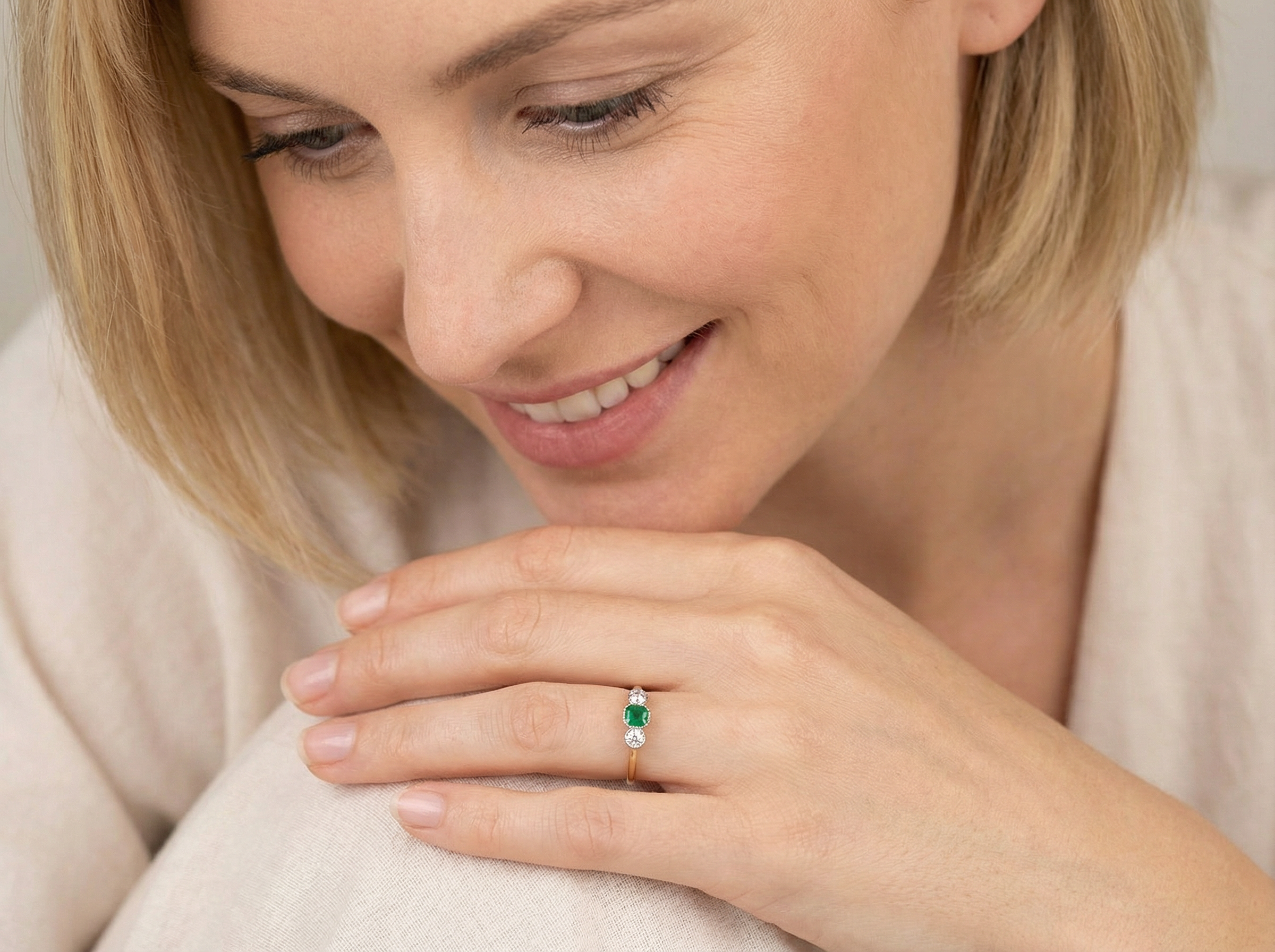 model A charming ring dating from the early to mid-20th century, beautifully crafted and full of period character.

The centrepiece is a vivid bright-green, cushion-shaped emerald 