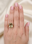 model A continental dress ring that tests as 18 carat gold. Features a large citrine gemstone, that measures 18x13mm, depth 9mm. Golden yellow with a hint of olive green.&nbsp;