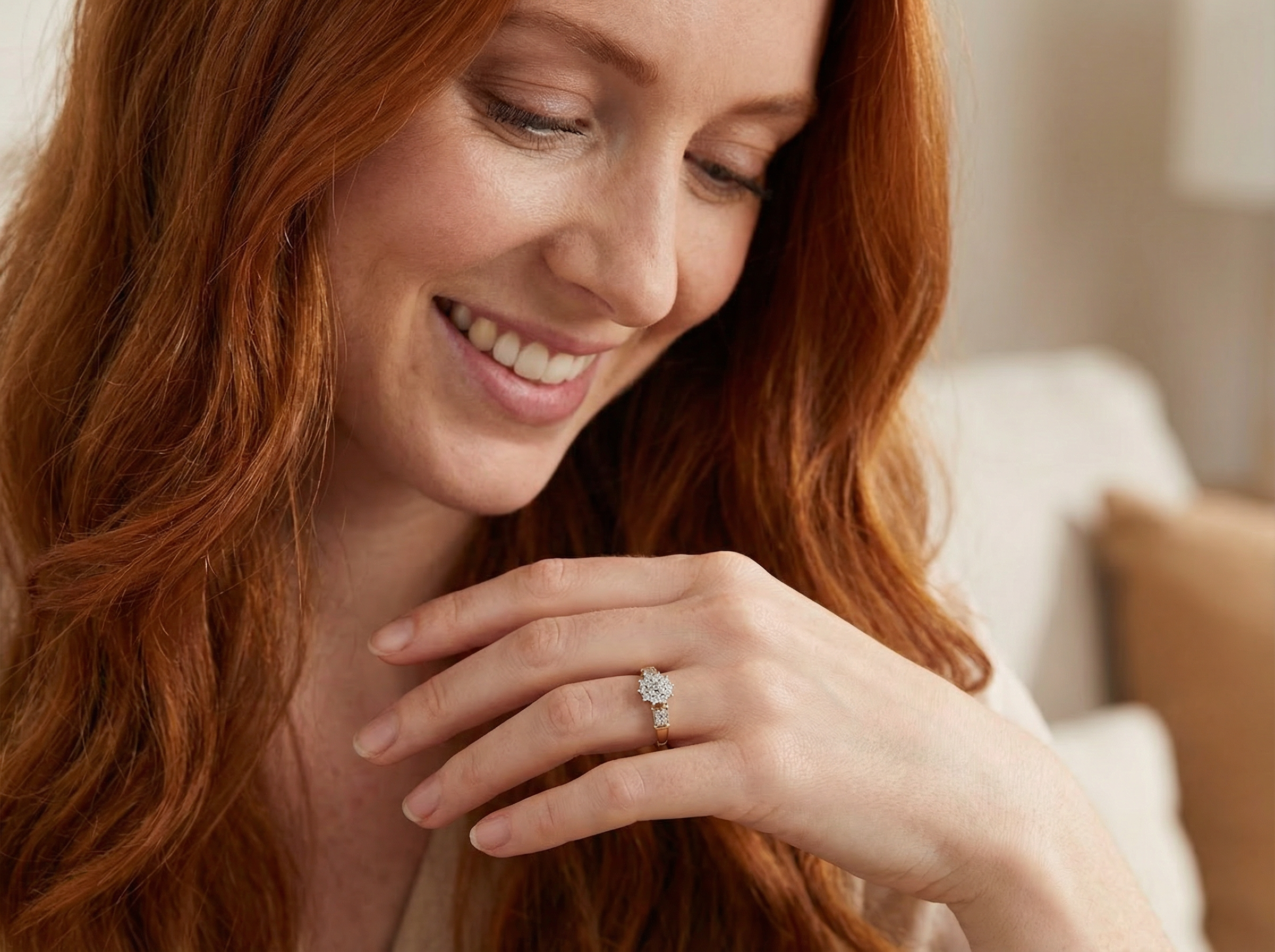 model A modern 9 carat gold cluster ring featuring a round head fully set with nineteen brilliant-cut white diamonds,