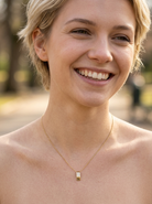 model A modern block style pendant. Measures 17x6.3mm. Set with three princess cut white diamonds, close set, each measures 2.75-2.85mm (total est 0.40 carats).&nbsp;