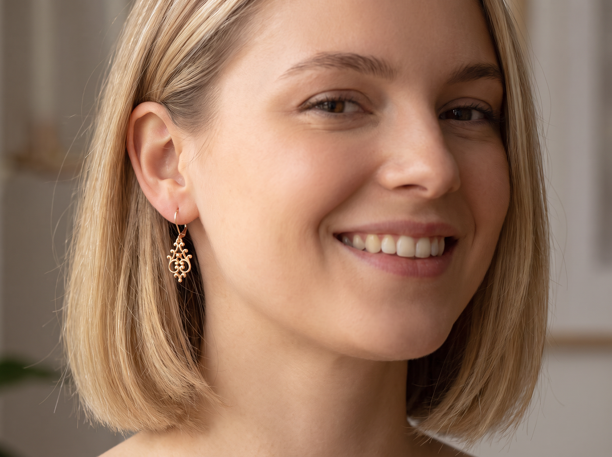 model A pair of 9 carat gold* drop earrings. Openwork Celtic look design.