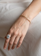 model A plain 9 carat gold, solid bangle (formally known as a slave bangle) Weighs 7.3 grams, round wire profile, just under 2mm.