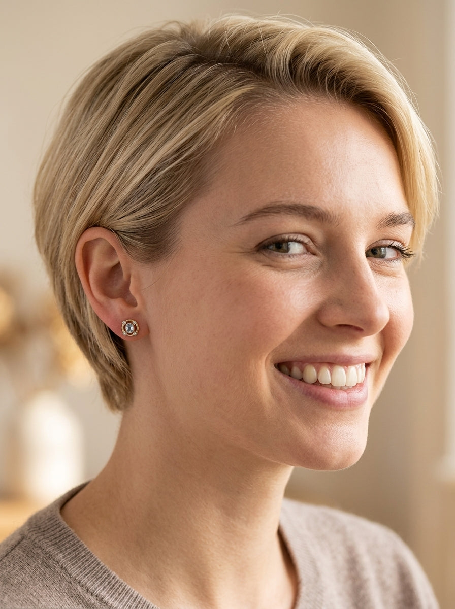 model A pretty pair of earrings. Each is set with an aquamarine centre stone, 6x4.5mm, cushion shaped.