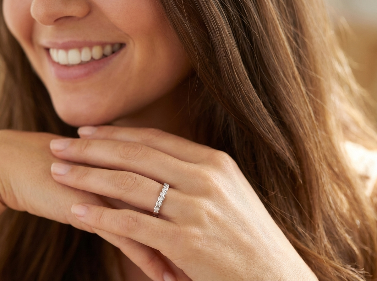 model An 18 carat white gold half hoop eternity ring. Set with seven brilliant cut white diamonds,