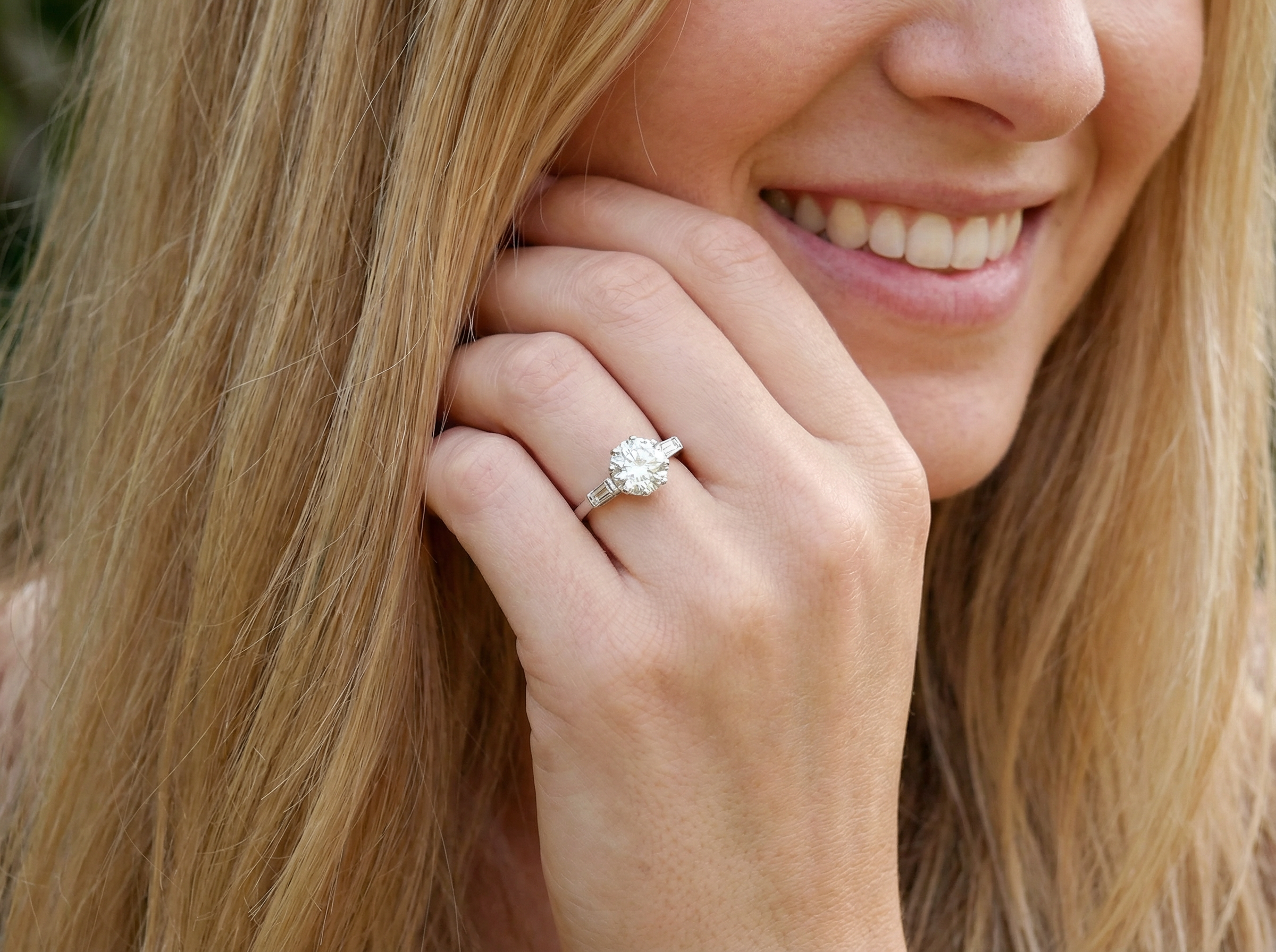 model An Art Deco solitaire ring showcasing a beautiful 1.75 carat diamond