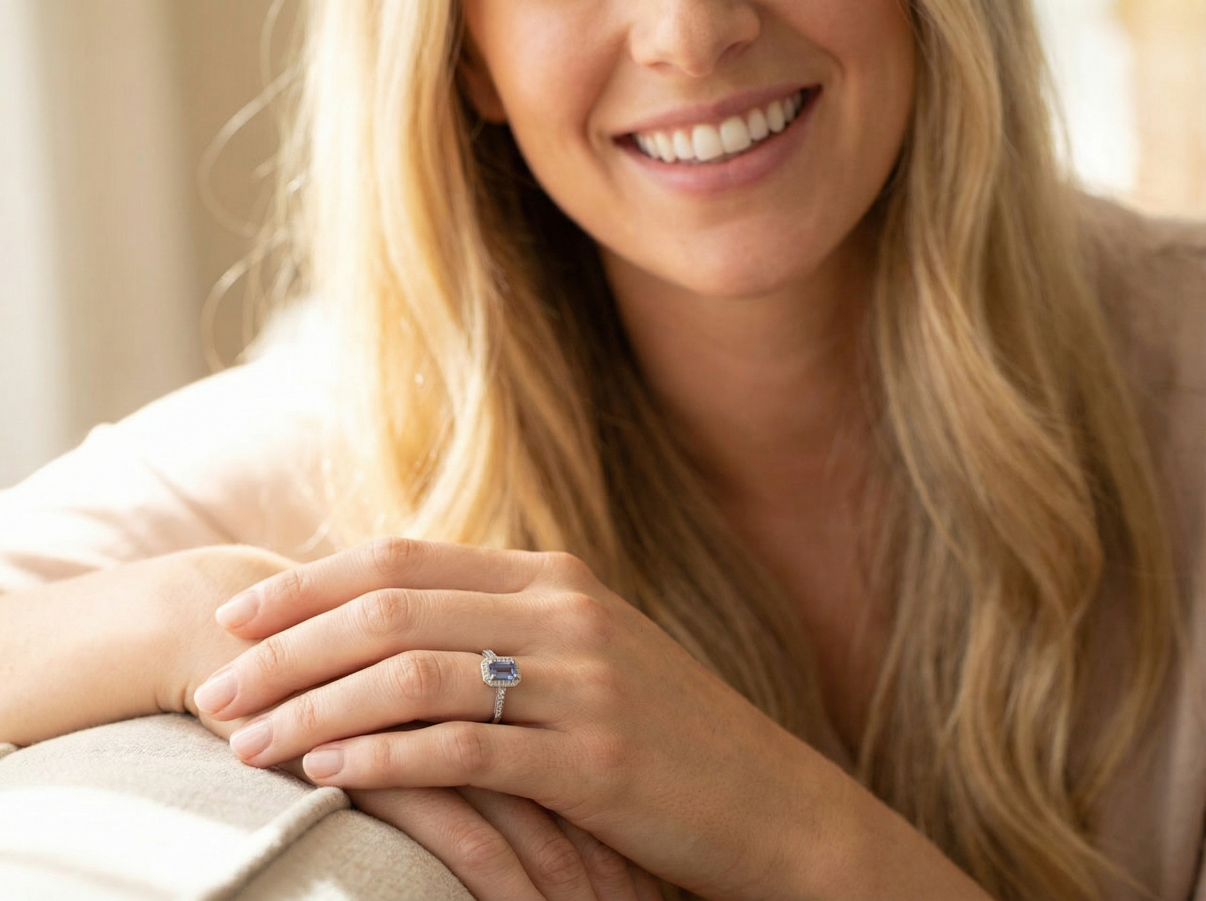 model An elegant cluster ring that features to the centre a rectangular tanzanite gemstone that measures 6x4mm (est 0.50 carats) AAA colour.