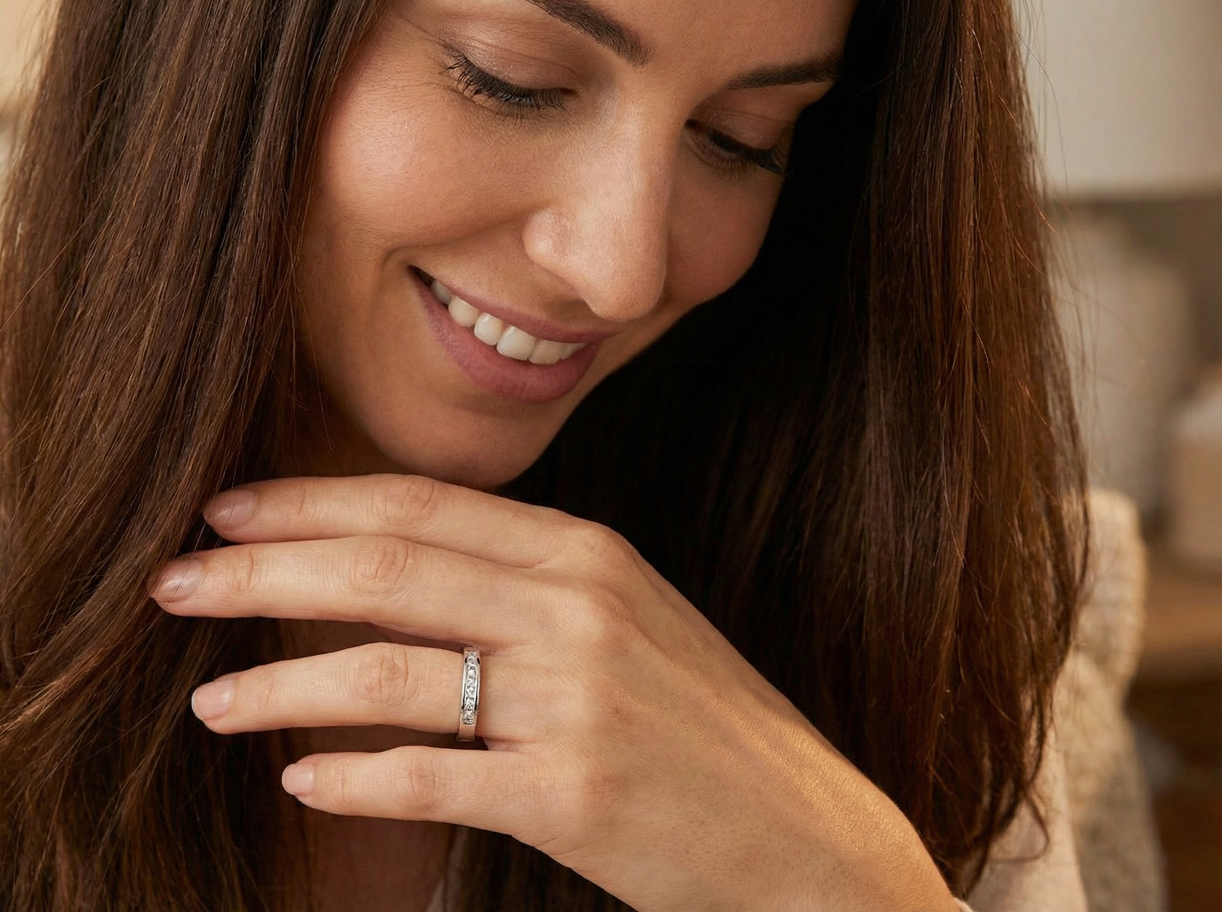 model An elegant half-hoop eternity ring set with nine princess-cut white diamonds, each measuring approximately 2.5mm, with a total estimated diamond weight of 0.90 carats.