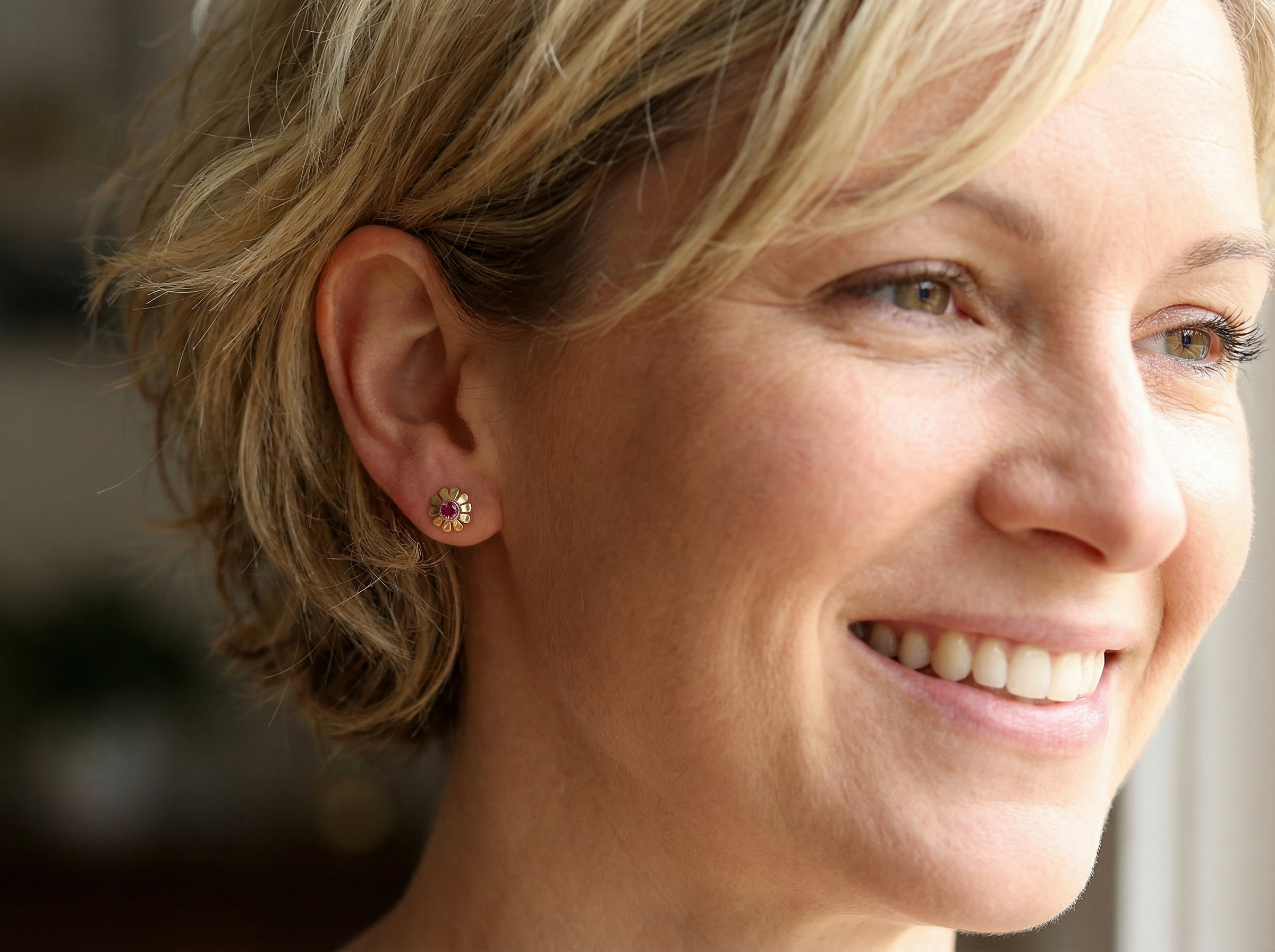 model An exceptional pair of ruby earrings.Each earring is centred with a cushion-shaped ruby measuring approximately 3.6–3.8mm, 