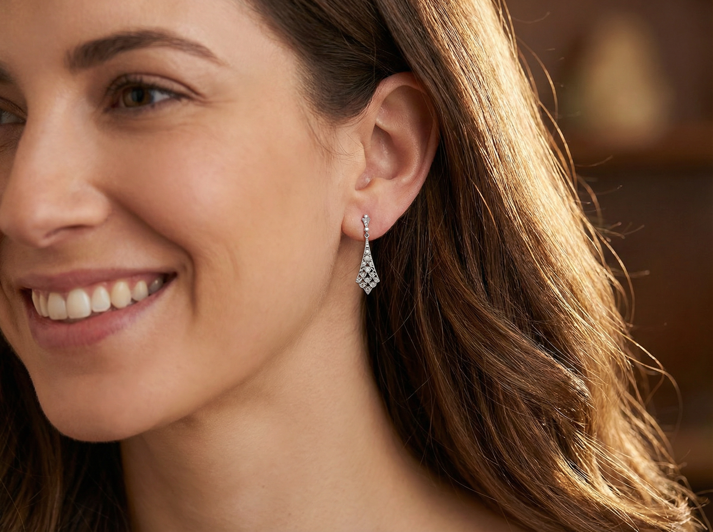 model Designed in the elegant style of the 1920s, these sophisticated drop earrings are crafted in 18ct white gold.
