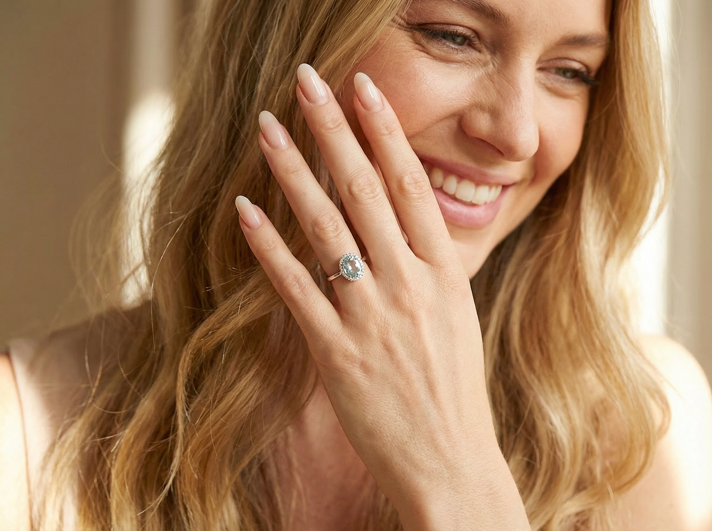 model  elegant cluster ring centred on a beautiful oval aquamarine, 