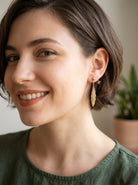 model feather earrings