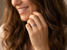 model pretty cluster ring that features an oval cut tanzanite gemstone,