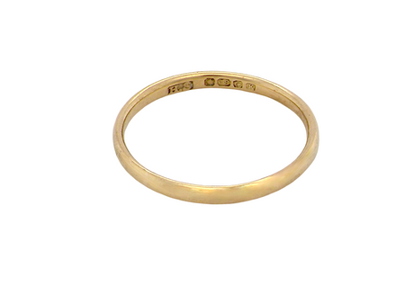  narrow 18 carat gold wedding ring. Traditional D shape profile.

Hallmarks for Birmingham 1934. 