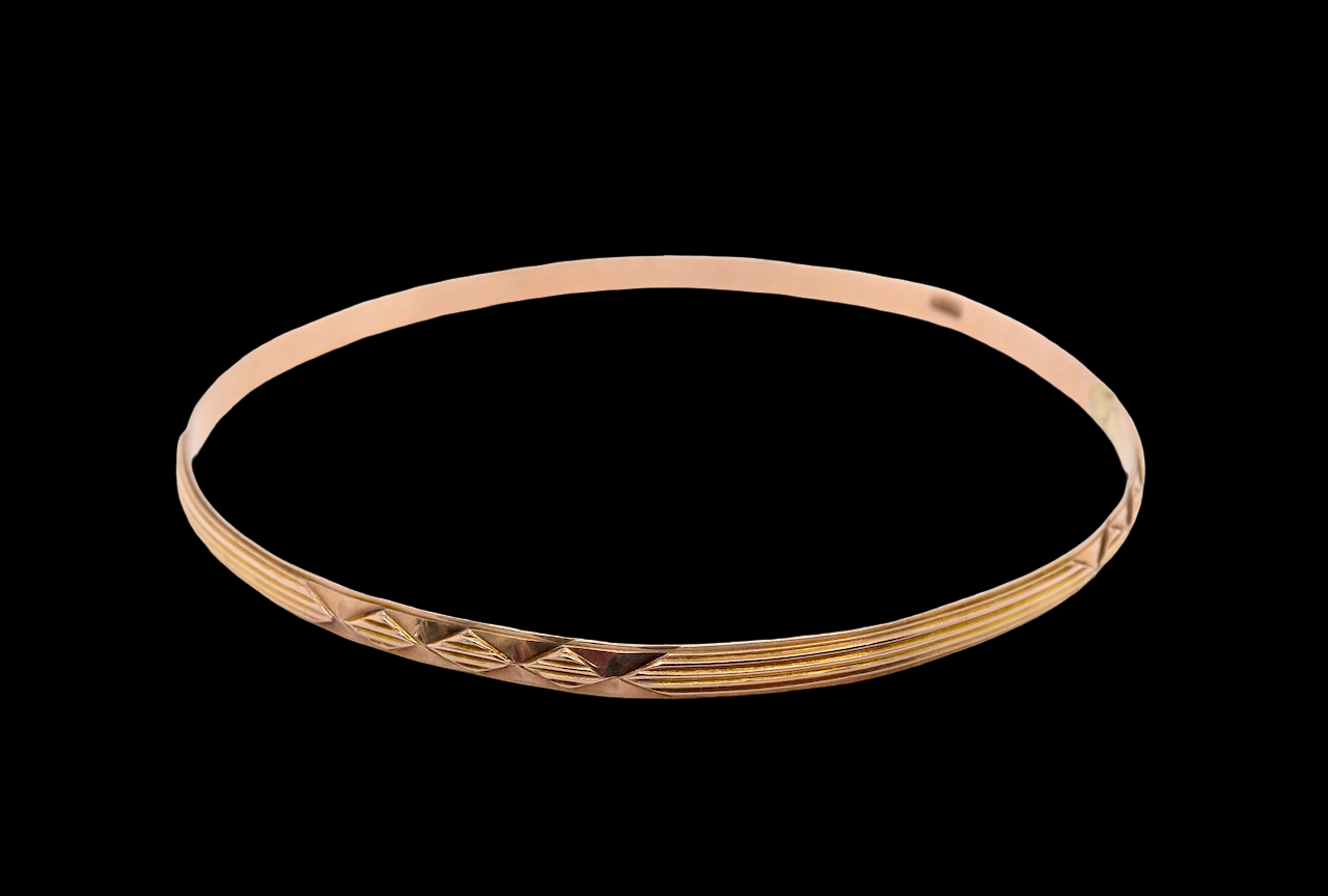 narrow gold bangle patterned