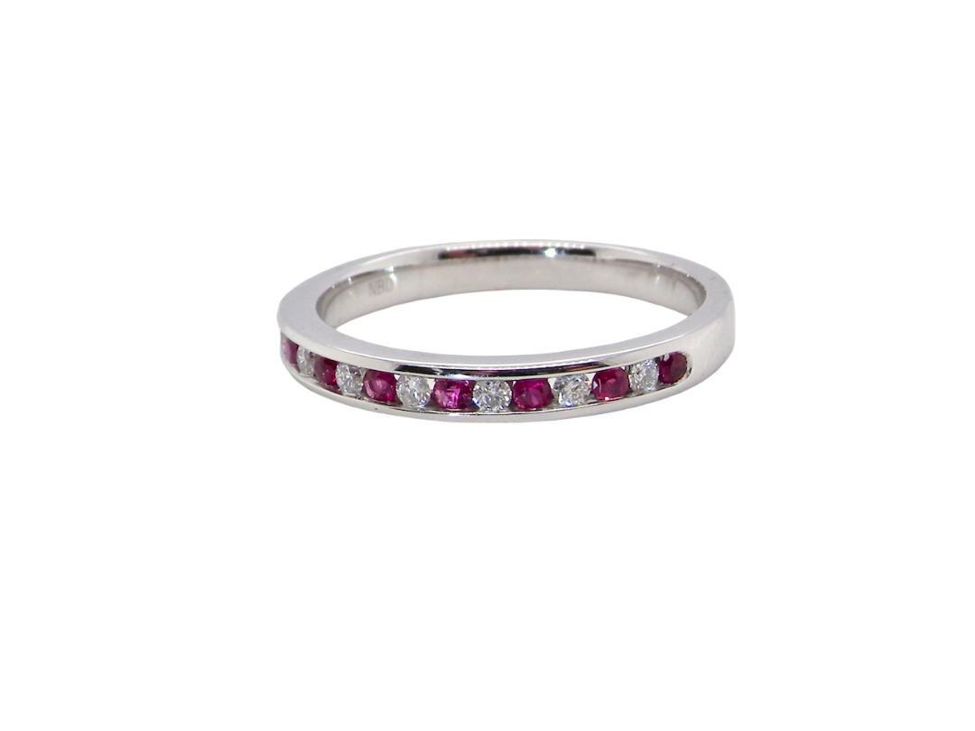 new A white gold half hoop eternity ring. Set with seven round rubies and six brilliant cut white diamonds
