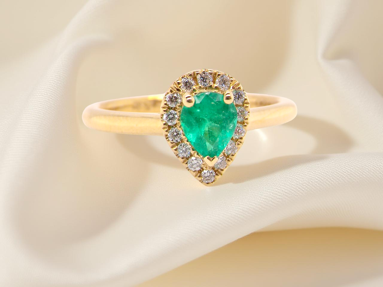 A new pear shaped Emerald and Diamond ring