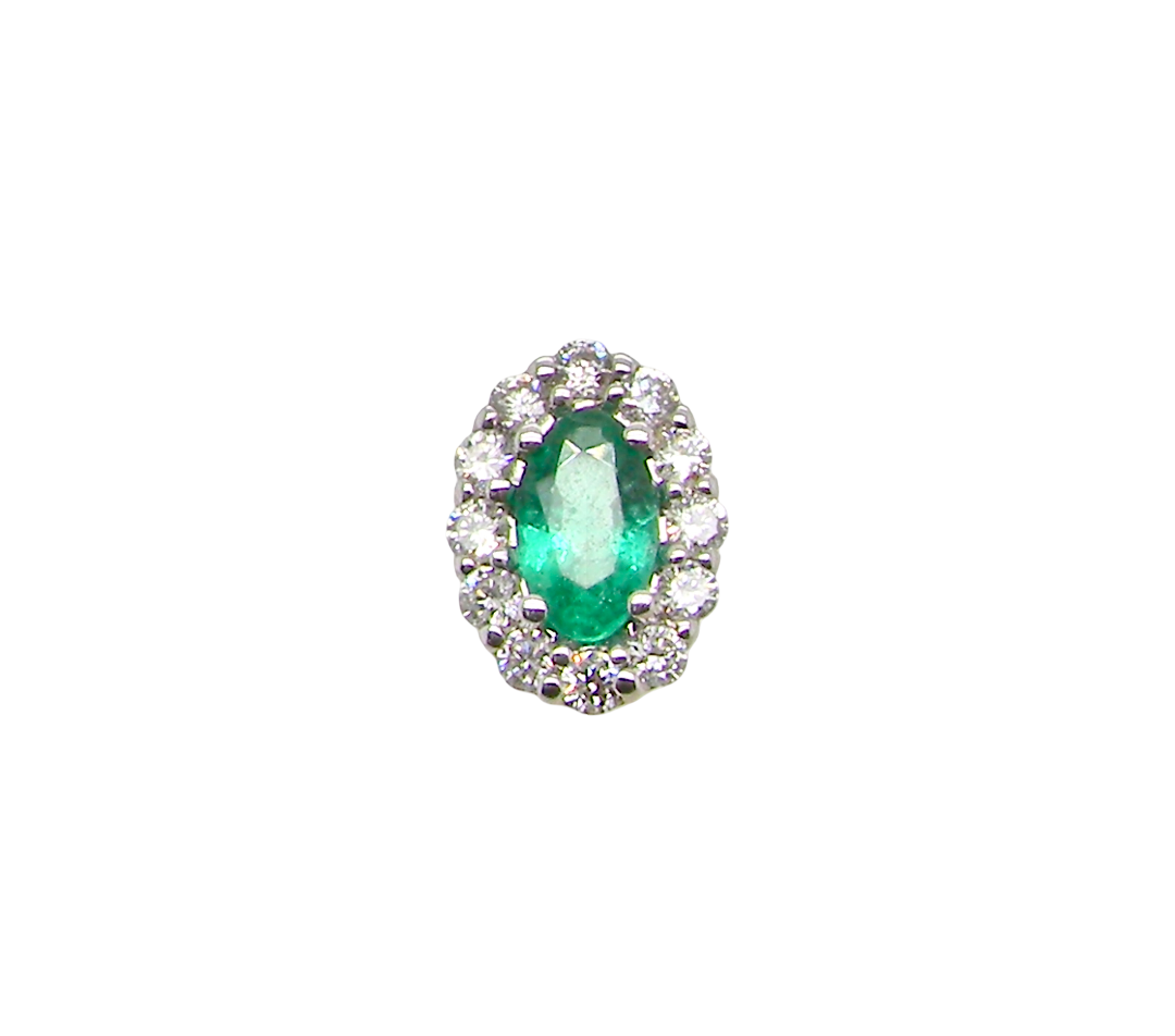 An oval emerald-cut green gemstone halo ring set in silver-toned metal with surrounding clear stones, isolated on a white background.
