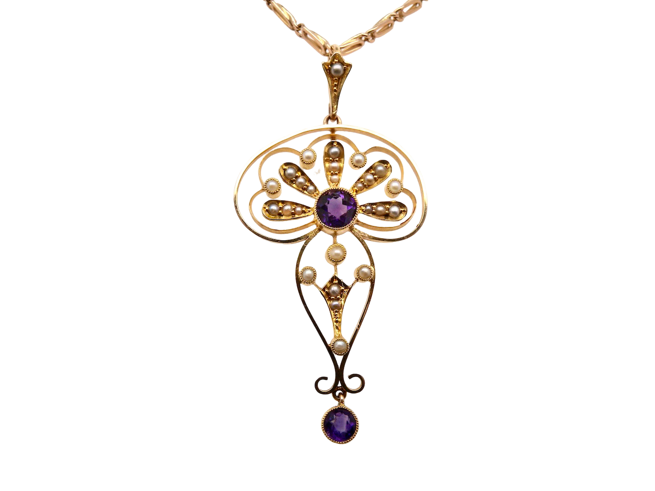 . This elegant piece typifies the glamour of the period, set with pearls and amethysts.