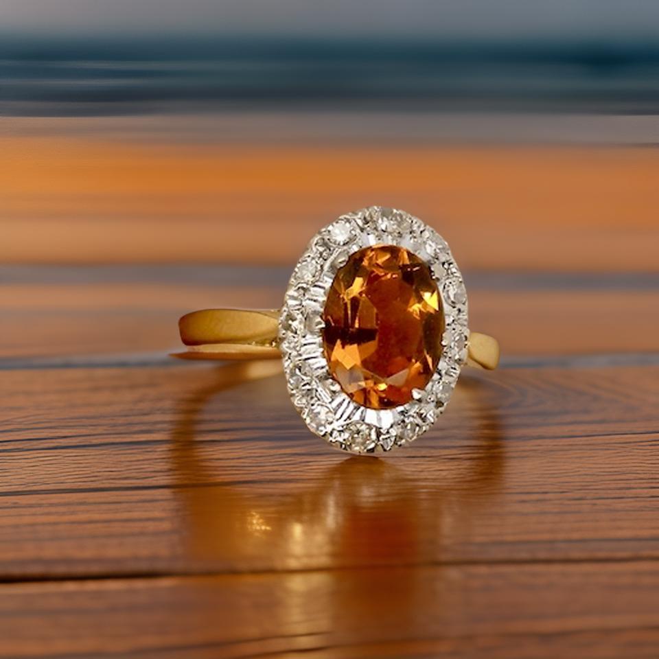 A yellow Topaz and Diamond ring