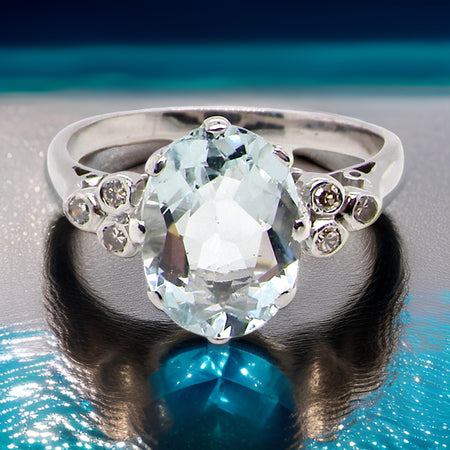 An aquamarine and diamond ring