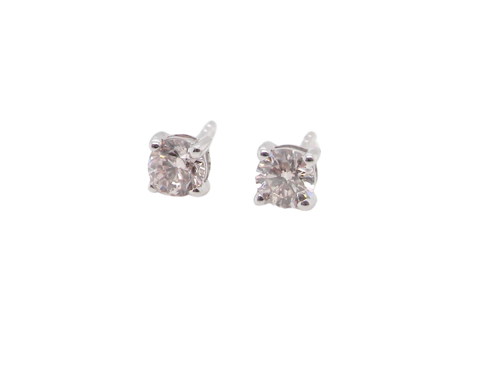  pair of half carat diamond stud earrings