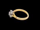 pretty cluster ring set with nine brilliant-cut white diamonds.
side