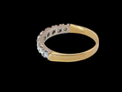 rear  1970s vintage half-hoop eternity ring, tested as 18 carat gold and elegantly set with nine brilliant-cut white diamonds. 