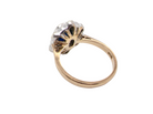 rear A 9 carat gold cluster ring that features an inky black blue oval cut sapphire. This measures 8x6mm in a safe rim style setting 
