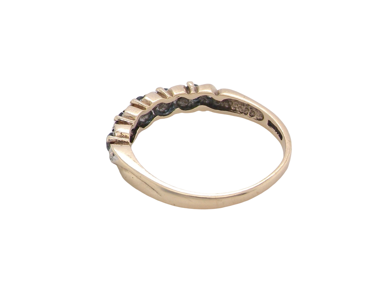 rear A 9 carat gold half hoop eternity ring. Set with five blue topaz gem stones, each 2.8mm.&nbsp;
