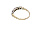 rear A 9 carat gold half hoop eternity ring. Set with four sapphires, each 2.4mm, and between each a 1mm illusion set diamond.
