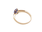 rear A 9 carat gold ring containing a single oval cut tanzanite gemstone. Measures 8x6mm, four claw setting.