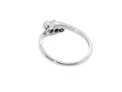 rear A 9 carat white gold cross over style trilogy ring. Three x 0.10mm diamonds, to an estimated at 0.30 carats.