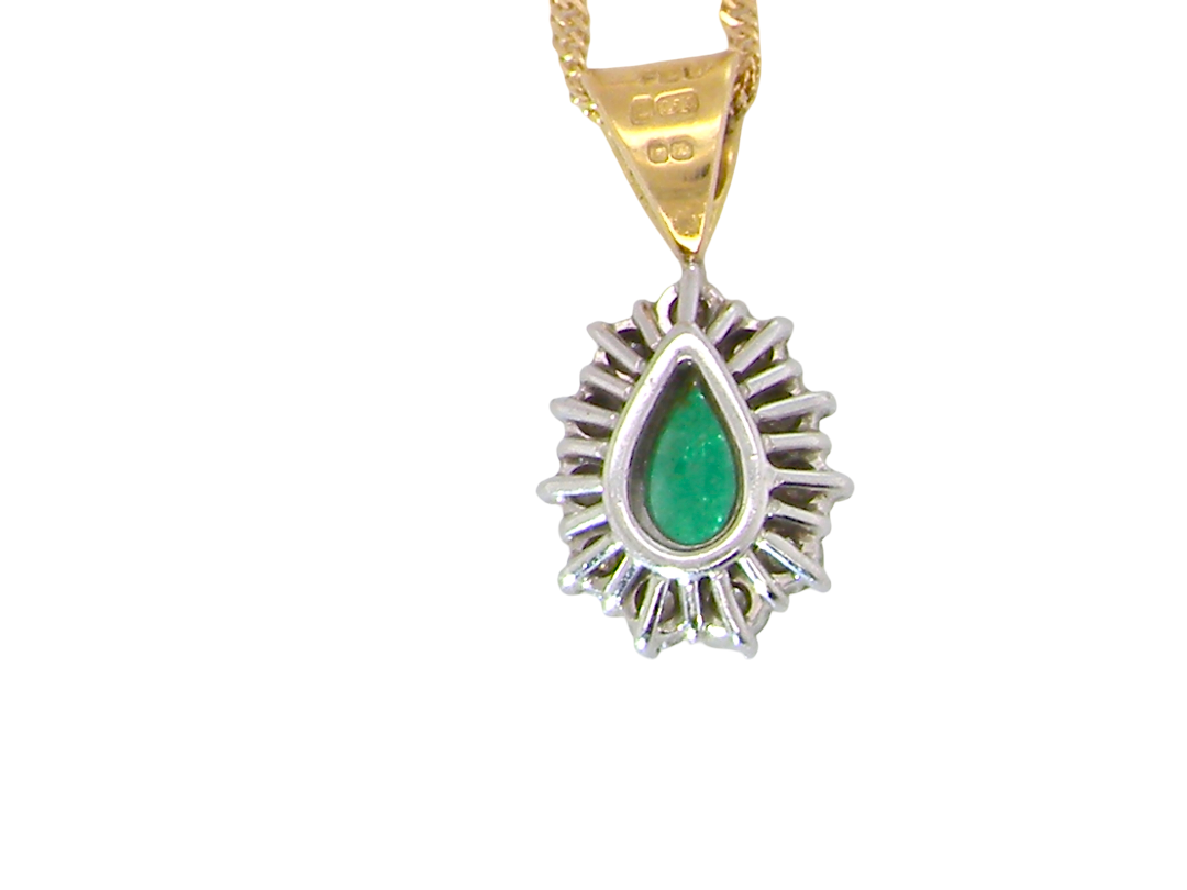 rear A beautiful pear shaped pendant. The emerald measures 7x5mm (0.75 carats est), good deep grass green colour.