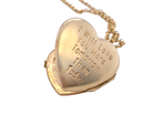 rear A charming heart-shaped locket, beautifully detailed with delicate scrolled engraving to the front. 
