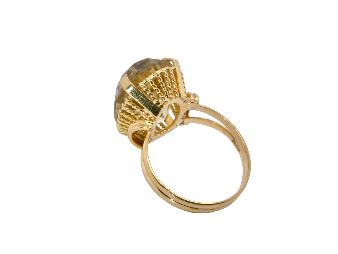 rear A continental dress ring that tests as 18 carat gold. Features a large citrine gemstone, that measures 18x13mm, depth 9mm. Golden yellow with a hint of olive green.&nbsp;