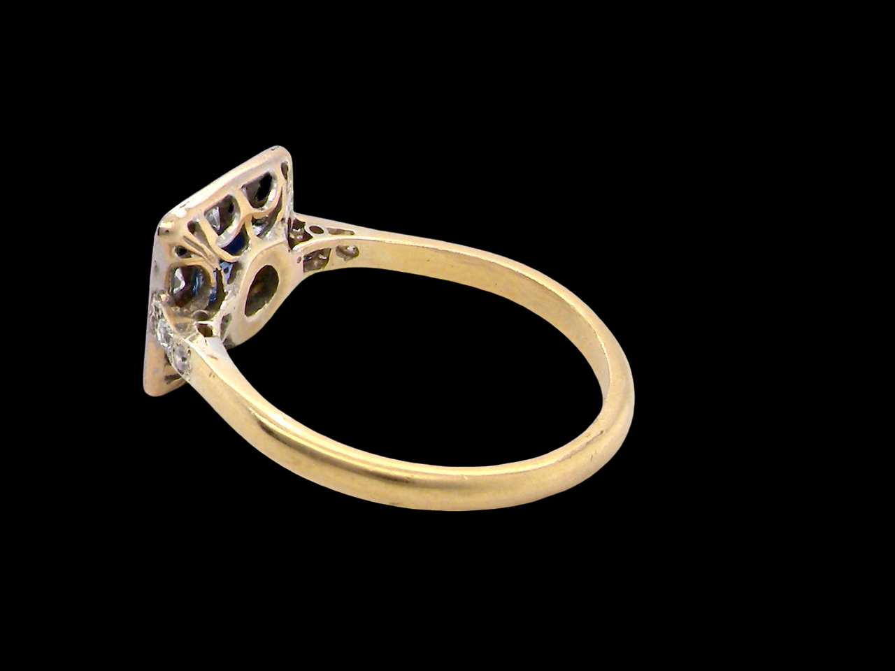 rear A fine Art Deco cluster ring. The centre stone a square sapphire 5x5mm (est 0.50 carats) in a mille grain setting.
