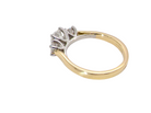 rear A fine and impressive three stone diamond trilogy ring, beautifully set with three graduated brilliant cut white diamonds.
