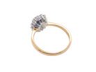 rear A fine cluster ring that features a black blue oval cut sapphire that measures 7x5mm (est 0.75 carats)
