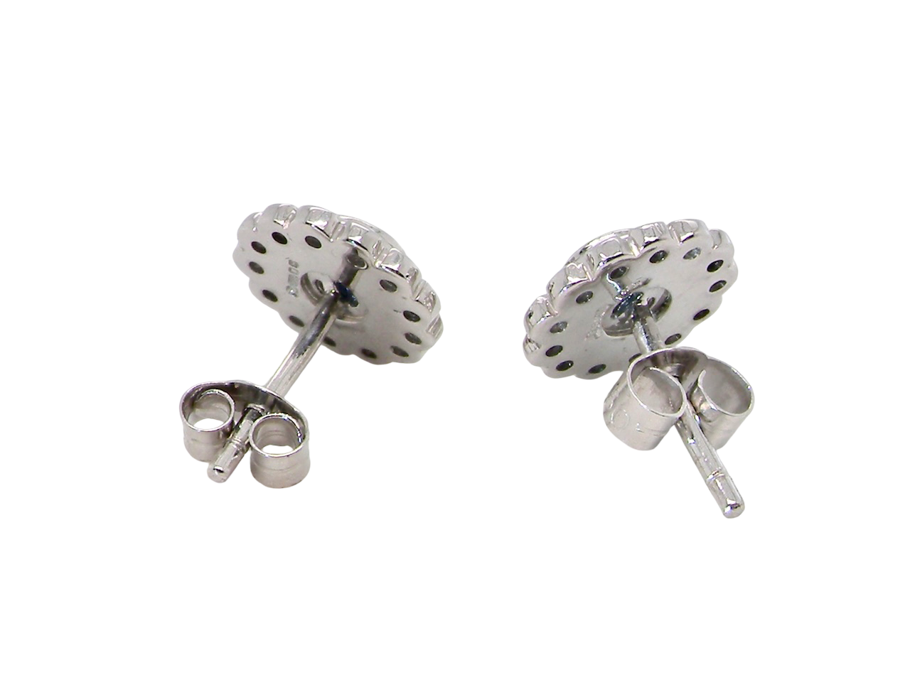 rear  A fine pair of 18 carat white gold sapphire and diamond cluster earrings.

Each earring is set with a central round sapphire measuring approximately 3.4mm in diameter, estimated at 0.15ct, 