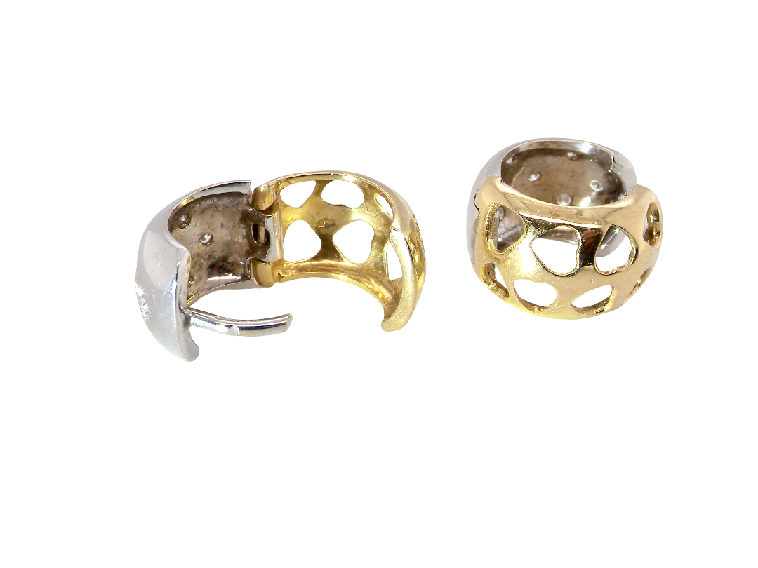 rear A fine pair of cuff style hoop earrings. The front part is 18 carat white gold * set with seven small white diamonds, 
